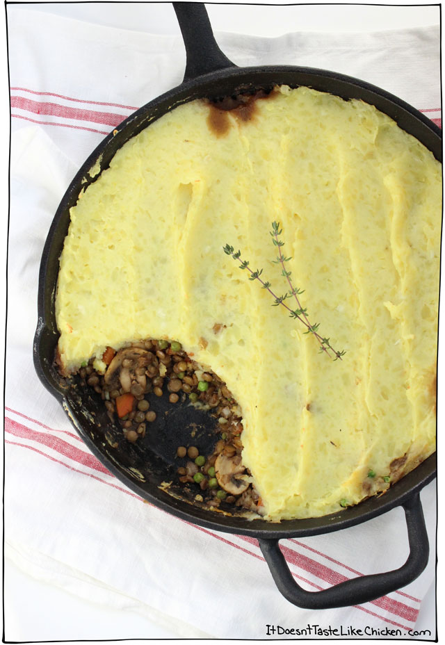 a cast iron pan of lentil shepherds pie with fresh tyme