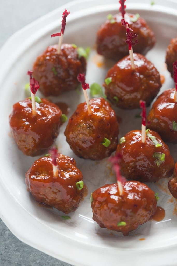 cranberry bbq meatballs with toothpicks on a plate