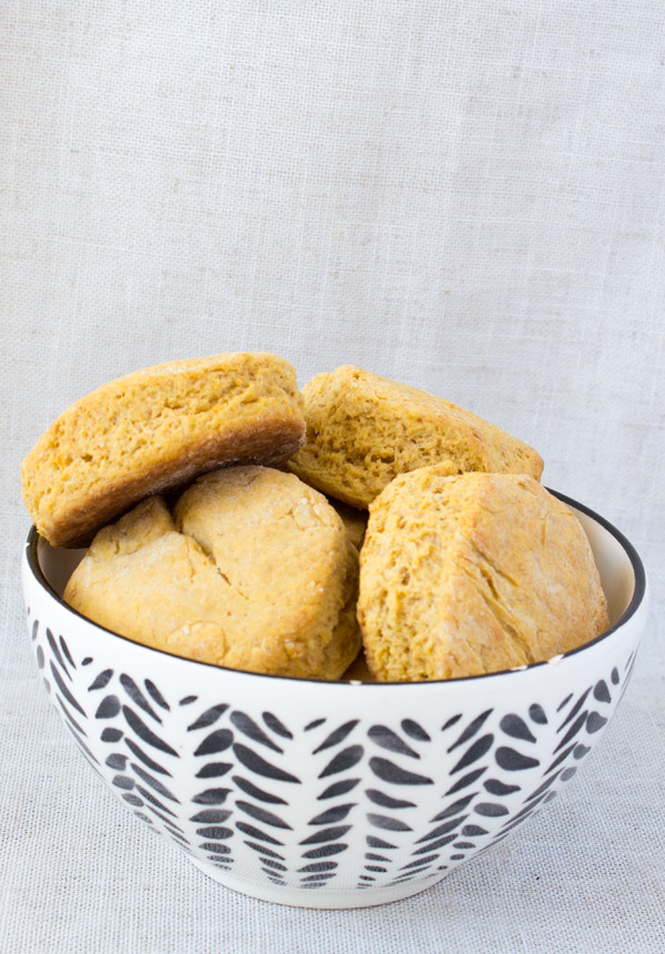 a patterned bowl of vegan sweet potato biscuits