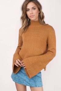 Designed by Tobi. The Benson Bell Sleeve Sweater features a mock neck and bell shaped sleeves for a nostalgic appeal. Pair with skinny or relaxed bottoms. 1 00% ACRYLIC