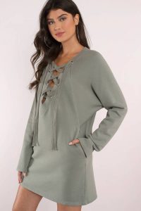 Talk cozy to me in the Olive Sophia Lace Up Sweatshirt. This lace up sweater dress is exactly how we like to stay warm and stylish this season featuring soft to the touch fabric and unique lace up front. An oversized sweater that's cozy, unique, and it has pockets? We like the sound of that.