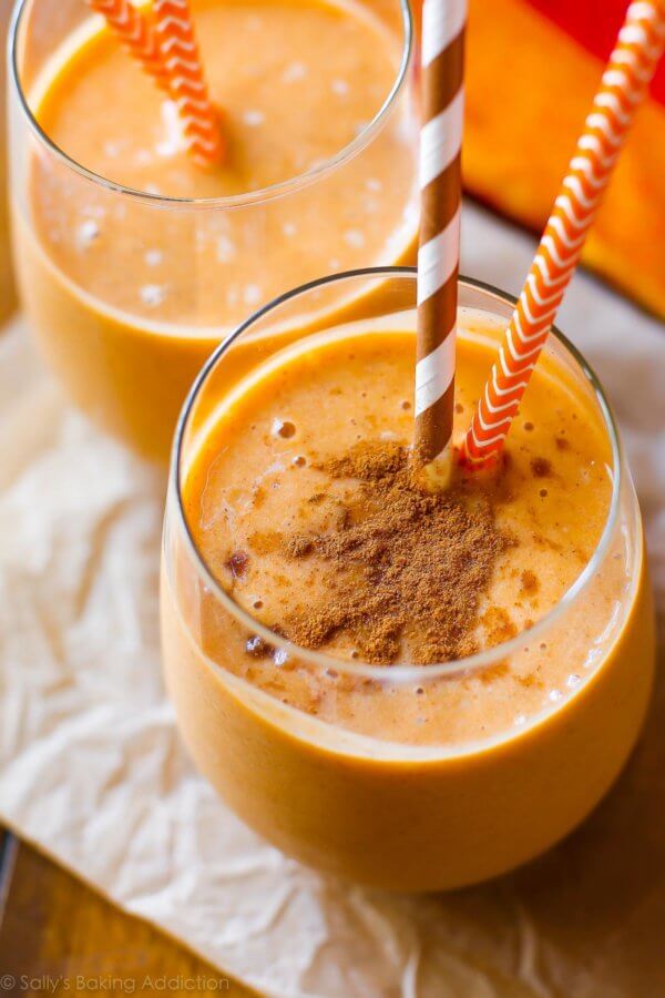 fall drinks: pumpkin pie smoothie in a glass with fall straws