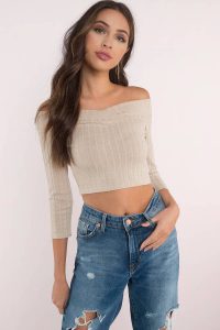 The Odele Off Shoulder Crop Top is a must have. Featuring an off shoulder neckline. Pair with distressed denim.