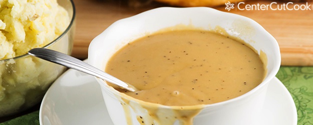 turkey gravy in a bowl with spoon