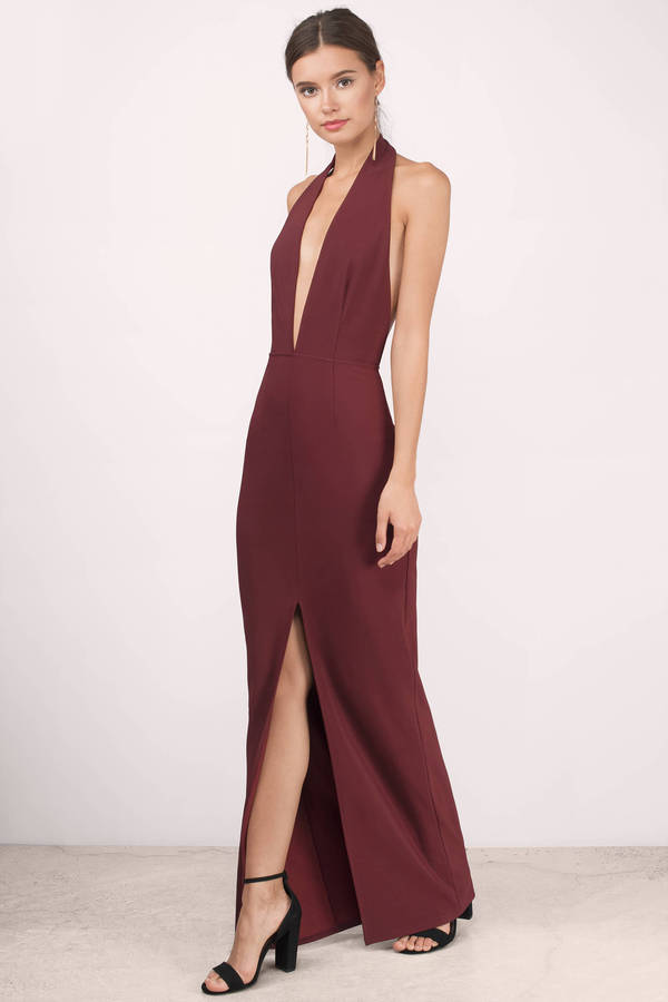 Wonder gal in the Wine Gala Deep Neck Maxi Dress. This striking halter maxi dress shows some skin with its plunging neckline and revealing open back. Pair with simple high heels alongside its slit in the front for a red carpet glam, just add statement earrings and a sleek ponytail.