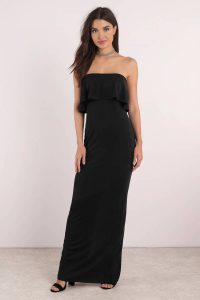 Stand out in the Milan Maxi Dress. Featuring strapless ruffle detail and back slit on a maxi dress. Pair with heels.