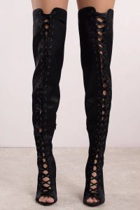 Our Rebel Rebel Lace Up Thigh High Boots are needed in every girl's closet. Featuring all over satin and a peep toe. Pair with a black basic bodycon dress and oversized denim jacket.