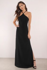 All high class in the Uptown Girl Maxi Dress. A lace up maxi dress with a loving halter neck, fitted bodice, and thin straps that cross to a dramatic back lace up. The heavenly skirt drapes to an effortless side slit that's super chic for all your special evening needs: weddings, dances, and red carpets because you're a star, love.