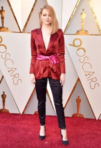 Emma Stone wearing a chic blazer and pants look at the Oscars.