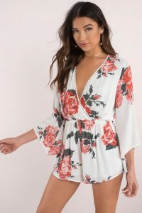 Highly desirable in the Can't Let Go Rose Print Romper. A kimono style, long sleeve romper featuring a deep v surplice neck with pretty pom pom trim detailing. Designed with a gorgeous rose pattern along a breezy silhouette, it's no question you should certainly pick this rose.