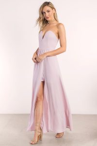 You'll have a major moment in the Krystal Strapless Maxi Dress. Slip into this strapless maxi dress adorned with a sweetheart neck and fitted bodice that's finished by a hidden back zipper closure. Features a flowy floor length skirt with front side slit to keep things interesting. Get ready, you're in for a lovely evening.