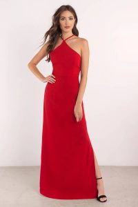 All high class in the Uptown Girl Maxi Dress. A lace up maxi dress with a loving halter neck, fitted bodice, and thin straps that cross to a dramatic back lace up. The heavenly skirt drapes to an effortless side slit that's super chic for all your special evening needs: weddings, dances, and red carpets because you're a star, love.