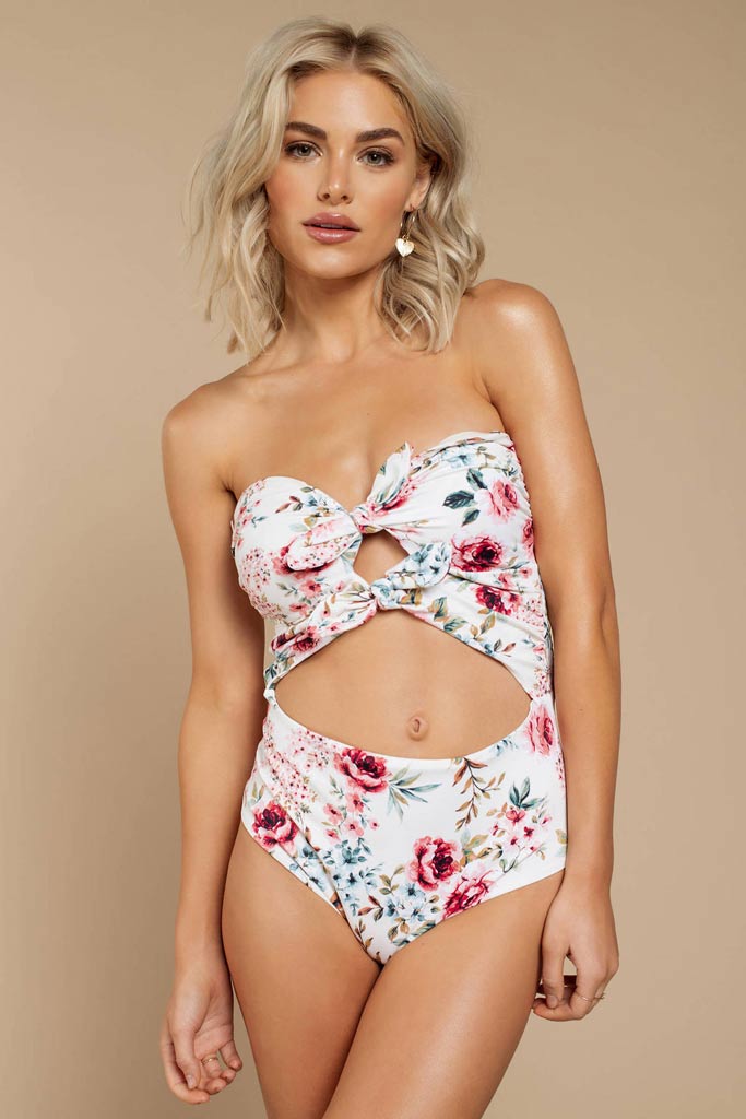 A floral one piece swimsuit with a midriff cutout