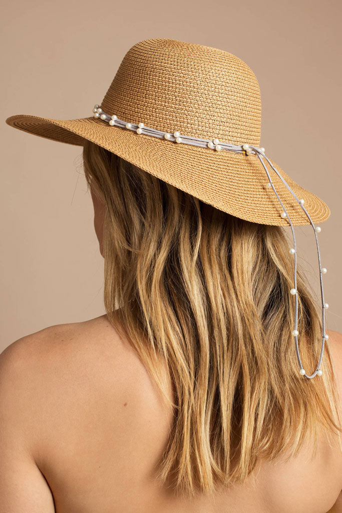 A stunning straw hat with pearl embellishments